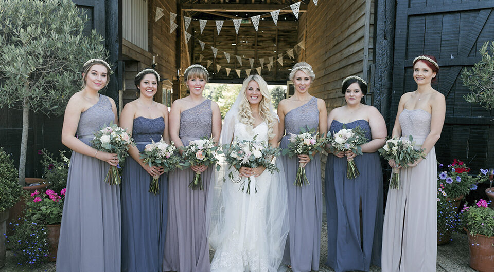 7.bride with blue and grey bridesmaids bunting upwaltham barns