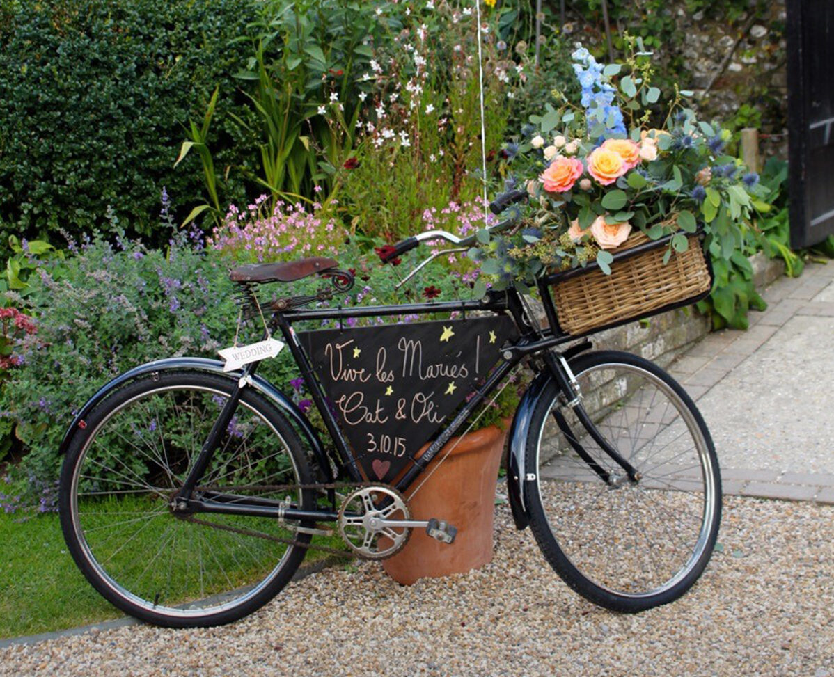 8.Spring wedding flowers vintage bike Upwaltham Barns