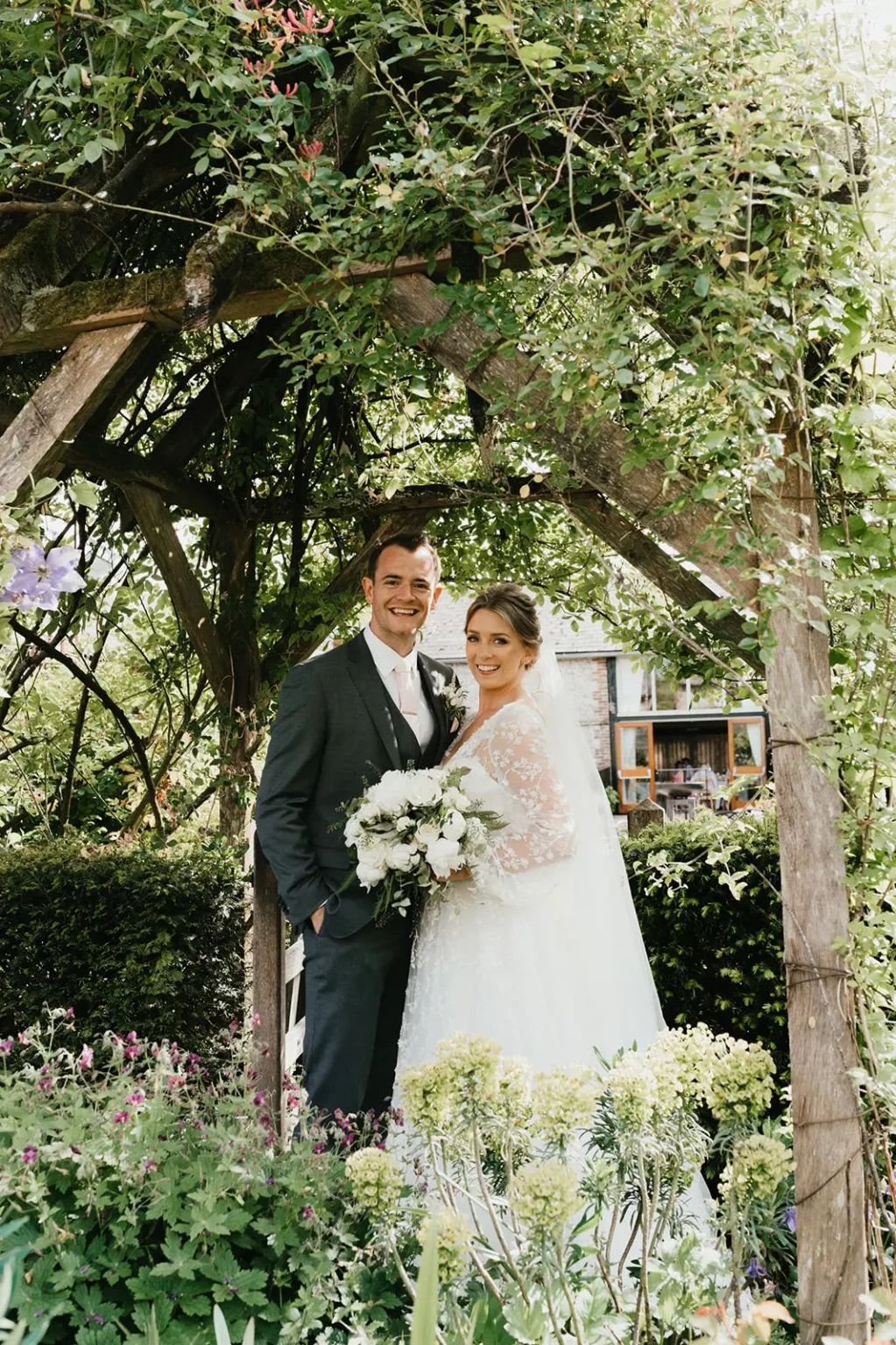 upwaltham-barns wedding gardens snug couple portrait