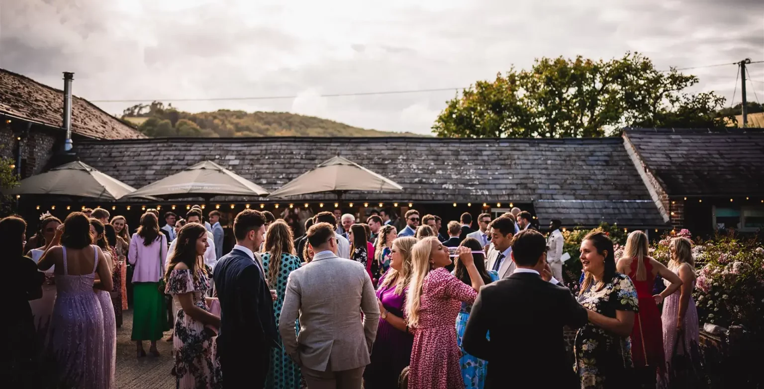 upwaltham barns wedding stable bar gathering outside