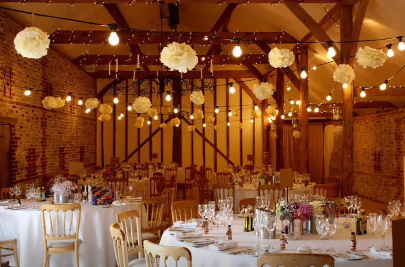 5.spring barn wedding ideas festoon lights upwaltham barns