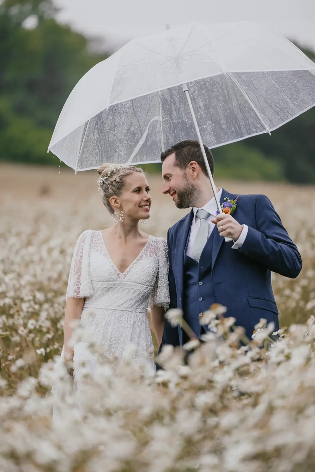 Upwaltham Barns bride and groom in the rain